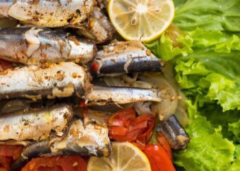 Σαρδέλες στον φούρνο με ντομάτες και φρέσκο κρεμμυδάκι